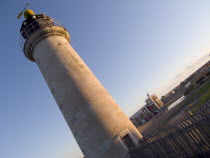 Angled view of the Lighthouse at Kingston Beach next to Shoreham Harbour in evening light