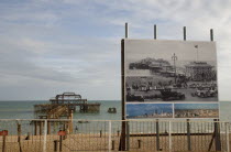 Ruins of the West pier with boards showing the pier in its former glory days.European Great Britain Northern Europe UK United Kingdom