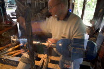 Amberley Working Museum. The West Sussex Woodturners with a man working at Machinery  demonstrating traditional wood-working tools and skills