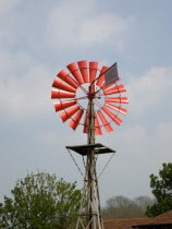 Amberley Working Museum. Orange wind vane pump