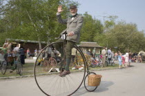 Amberley Working Museum. Veteran Cycle Day Grand Parade. Man wearing period custom riding a Penny Farthing bicycle