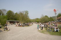 Amberley Working Museum. Veteran Cycle Day Grand Parade with visitors watching people riding bicycles displaying the development  and history of cycle design