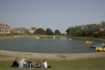 Families enjoying pedal boat rides at Oyster Pond Boating Lake