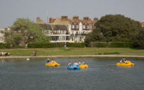 Families enjoying pedal boat rides at Oyster Pond Boating Lake