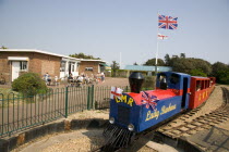 Families enjoying the Miniature Railway train ride at Norfolk Gardens. Union Jack Flag flying