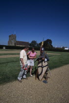 Battle Abbey. Saxon foot soldier talking to visitors in the grounds near to the spot where King Harold fell in the battle on Saturday 14th October 1066