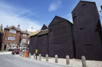 Tall black wooden huts close to the Fishermens Museum  originally used as workshops and storage for nets  sails and ropes
