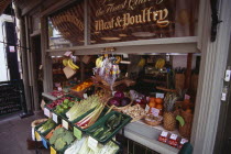 Old Town Butchers on George Street.  Shop frontage with fruit and vegetables displayed on stall outside with a meat and poultry sign on window.