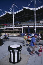 Gunwharf Keys. Waterfront restaurants and bars overlooking the marina with people walking past on the pedestrian walkway