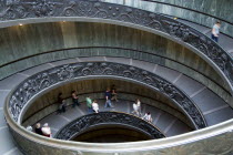 Vatican City People descending the spiral ramp from the Museum to the street designed in 1932 by Guiseppe Momo