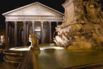 Piazza della Rotonda The marble fountain designed in 1578 by Giacomo Della Porta illuminated at night in front of the Pantheon the Roman temple of all the gods which became a catholic church in the Mi...