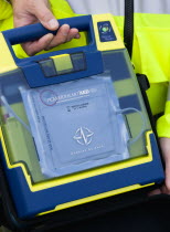 Sheep Fair Ambulance service driver holding a mobile emergency fibulator