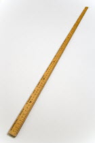 Wooden metre ruler with measurements in centimetres