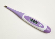Purple digital thermometer showing scale reading in degrees celcius
