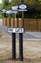 To Let and For Sale signs on wooden fencing outside a newly built housing development in a road called Pay Gate