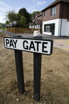 To Let signs on wooden fencing outside a newly built housing development in a road called Pay Gate