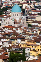 ITALY, Tuscany, Florence, The green copper dome of the 19th Century Tempio Maggiore, the Great Synagogue of Florence and city rooftops.