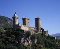 Chateau Foix on rocky hilltop above town.  Built on 7th century fortification and known to date from the 10th century.  Now houses the Musee d Ariege.