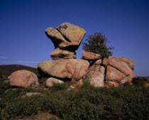 Granite rock formation known as  Roc Cornut .  Anvil-shaped boulder appearing to balance on another.