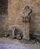 Montmaur.  Disc shaped crosses outside the Eglise St Baudile thought to be associated with the Cathars.