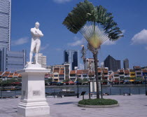 White poly marble statue of Sir Stamford Raffles on the north bank of the Singapore River at the site where he is first thought to have set foot in Singapore.