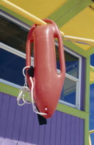Rescue float hanging from colourful lifeguard station