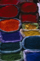 Brightly coloured dyes for sale in market.