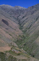 View  to Surlivaka Religious Centre and valley stretching up to high Sierra. A very sacred community of Kogi mamas priests live in the cluster of old cansa maria temples seen in the valley