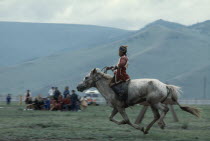 Nadam  National Day  Child jockey coming to end of 20 mile cross country horse race  all jockeys must be under 12 years old    child will weigh less and not overstretch the horse.Ulaan Baatar East As...