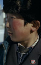 Altai provincial capital  Portrait of young boy with Mongolian Communist Party badge in profile to left.East Asia Asian Kids Mongol Uls Mongolian