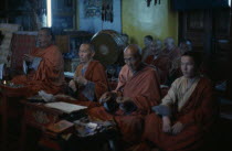 Buddhist monks in Ulan Bators only temple allowed by the authorities in 1974. They chant and pray in low lit temple interior in trance like state.Ulaanbaatar East Asia Asian Baator Mongol Uls Mongoli...