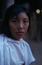 One of headman Josecitos grand-daughters wearing an old family gold nose ring  in Arquia community. Cuna American Colombian Columbia Female Women Girl Lady Hispanic Latin America Latino South America