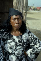 Guajira Indian woman standing in typical manta guajira at entrance to open slatted desert home.Wayu Wayuu GuajiroAmerindian Arawakan Colombia-Venezuela border American Colombian Columbia Female Wome...