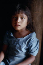 Portrait of young Makuna girl at the entrance to the maloca communal home.Tukano  Makuna Indian North Western Amazonia American Colombian Columbia Hispanic Indegent Kids Latin America Latino South Am...