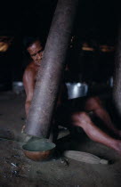Makuna man emptying pounded powdered coca from Yarumo hollow tube into gourd Tukano  Makuna Indian North Western Amazonia American Colombian Columbia  Indegent Latin America Latino Male Men Guy South...