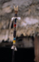 Detail of top of Makuna Kurubeti stave used by shamans to ward off evil spirits  thunder and tropical storms  decorated with humming-bird  macaw and egret feathers and teeth of wild boar.Tukano Makuna...