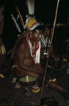 Barasana shamans & elders led by revered shaman Cristo chant to reach ancient world of ancestors  holding sacred hardwood prayer staves  some wearing ancient quartz pendants wild boar teeth belts and...