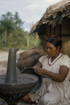 Barasana woman  Paulina  headman Boscos sister  making clay cooking pot. Note the larger fired pot behind her. A fine potter whose death has marked the virtual extinction of pottery-making amongst the...