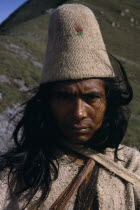 Portrait of Ika man in traditional dress.Helmet made from woven fique cactus fibre  manta cloak from woven wool&cotton Arhuaco Aruaco indigenous tribe American Classic Classical Colombian Colombia Hi...