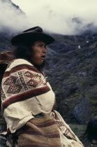 Portrait of Ika shepherd wrapped in woven wool&cotton manta cloak  high in Sierra Nevada de Santa Marta.Arhuaco Aruaco indigenous tribe American Colombian Colombia Hispanic Indegent Latin America Lat...