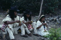 Ika  children of the Chaparro family beside grave of their father an Ika leader murdered by paramilitaries linked to the Colombian Army.Arhuaco Aruaco indigenous tribe mourning funeral death American...