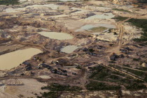 Gold mine on former Panara territory showing miners settlement and mercury washing pools  deforestation and pollution.Garimpeiro                      prospectors have displaced the Panara  formerly kn...