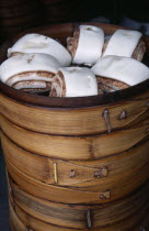 Steamed buns in bamboo steamer.
