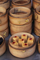 Donghua Yeshi food market.  Display of bamboo steamers of sweetmeats.