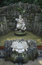 Fountain with statue of Neptune in Hellbrunn Palace Gardens known for the  surprise  fountains in its grounds dating from the 17th c.