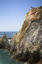 Cliff diver  a clavadista  diving off the cliffs at La Quebrada