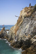 Cliff diver  a clavadista  diving off the cliffs at La Quebrada