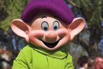 Walt Disney World Resort. Disney MGM Studios. Dopey  a dwarf from Cinderella during the Stars and Motor Cars Parade.TravelTourismHolidayVacationExploreRecreationLeisureSightseeingTouristAttr...