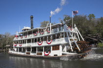 Walt Disney World Resort. Liberty Belle Paddle Steamer  Liberty Square Riverboat on a lake in the Magic Kingdom.TravelTourismHolidayVacationExploreRecreationLeisureSightseeingTouristAttracti...