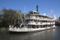 Walt Disney World Resort. Liberty Belle Paddle Steamer  Liberty Square Riverboat on a lake in the Magic Kingdom.TravelTourismHolidayVacationExploreRecreationLeisureSightseeingTouristAttracti...